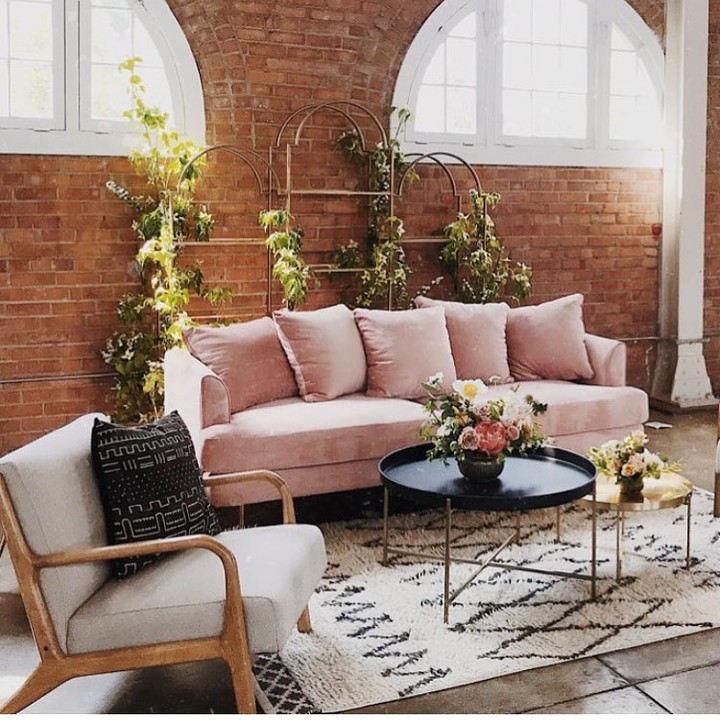 pink-sofa-with-brick-wall