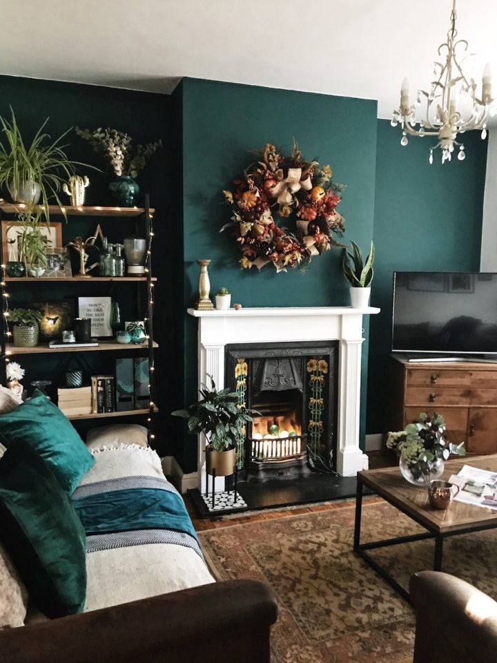 living room with fireplace darl green accent wall