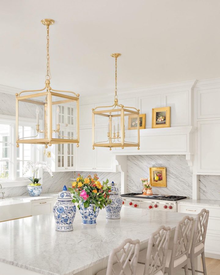 One-Of-A-Kind Classic Interior white kitchen with gold island lighting
