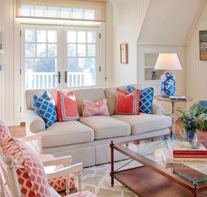 traditional neutral living room with pops of colors blue and red