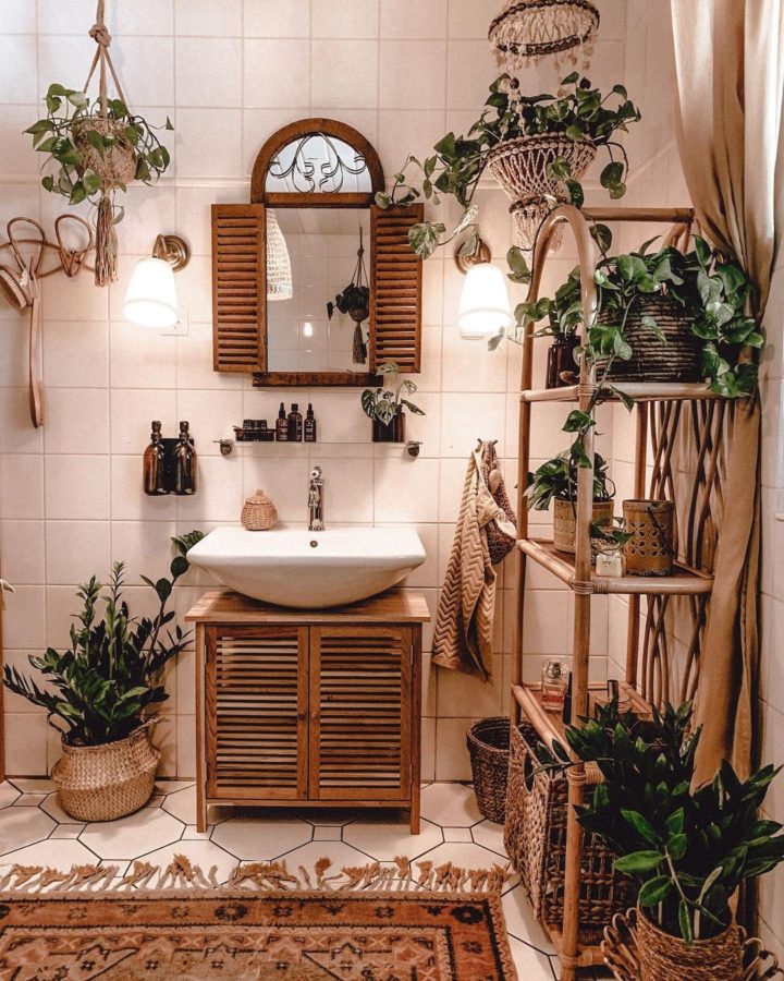 white boho bathroom with rattan shelving wood furniture 	mirror that look like window