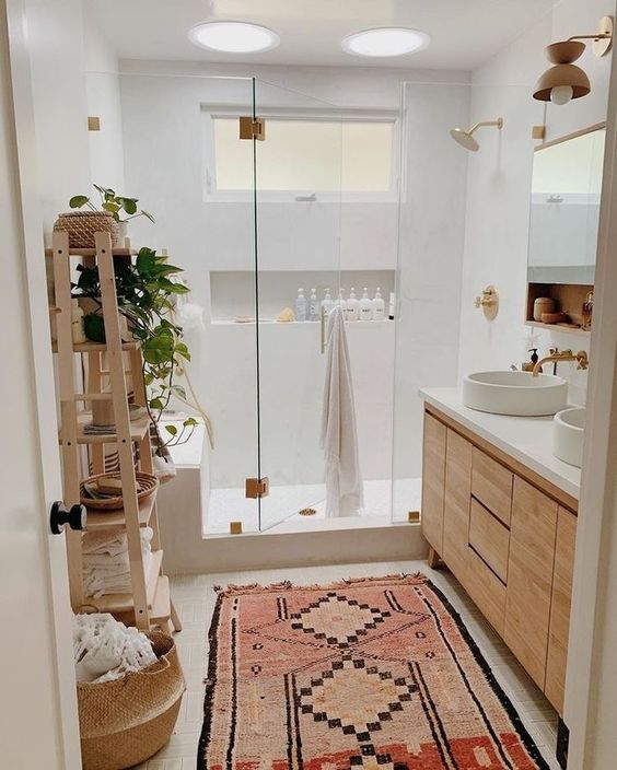 modern boho white bathroom with light wood vanity and colorful kilim rug