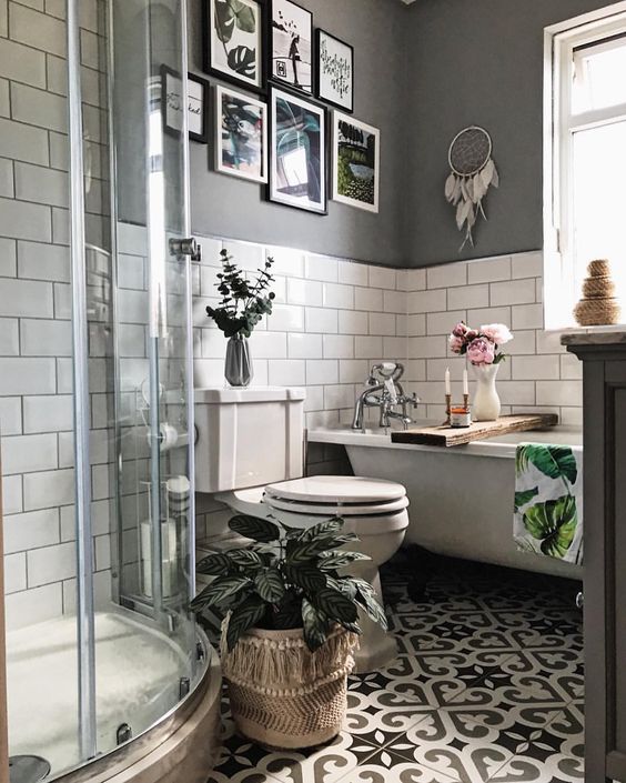 grey and white boho bathroon with wall art and Patterned Tiles