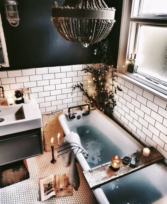 black and white boho spa bathroom with candles