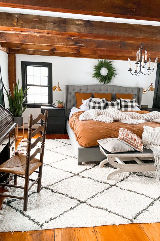 boho farmhouse bedroom with exposed wood
