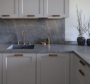 gray kitchen cabinets-with gold hardware and gray marble countertop