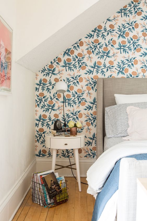 bedroom with playfully patterned wallpaper 