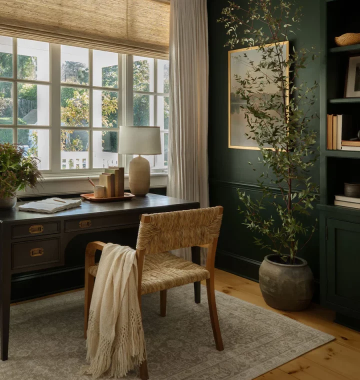 dark green home office with large window