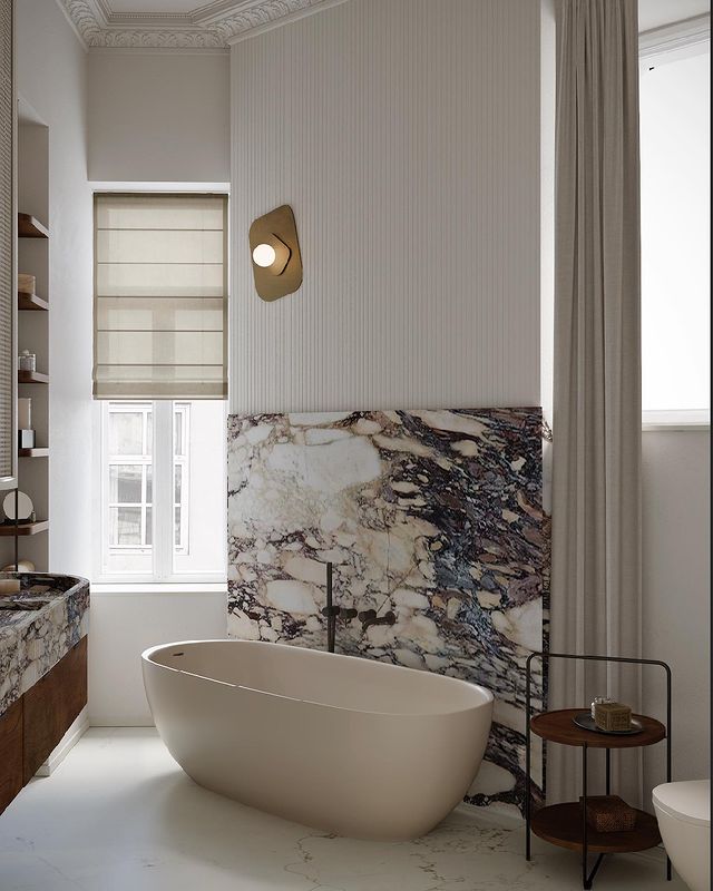 marble bathroom with freestanding tub