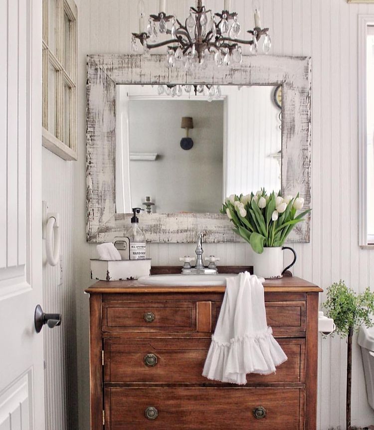 shabby chic bathroom with old wood dresser as unit