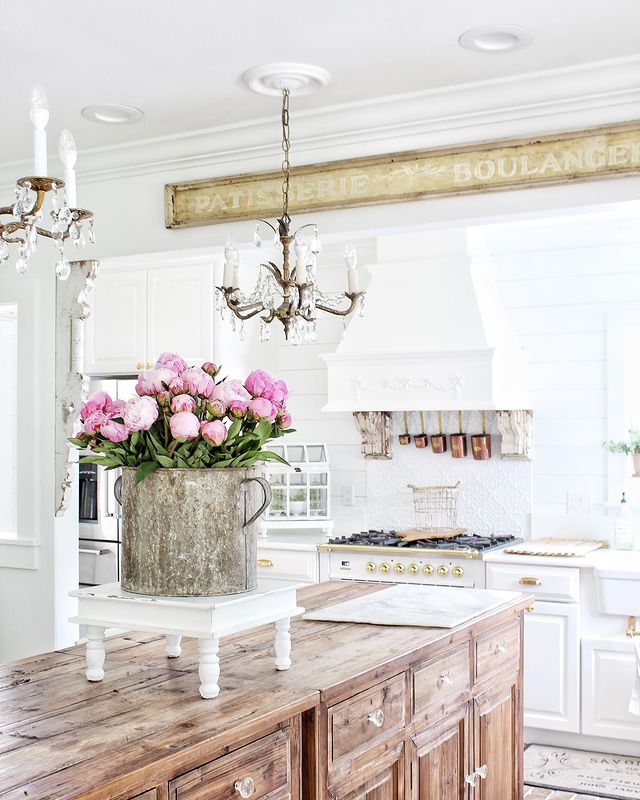 shabby chic kitchen with old wood dressers as kitchen island