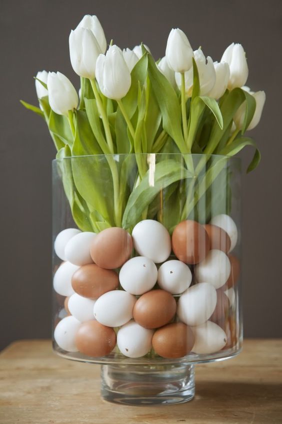Easter floral centerpiece with eggs and white tulips