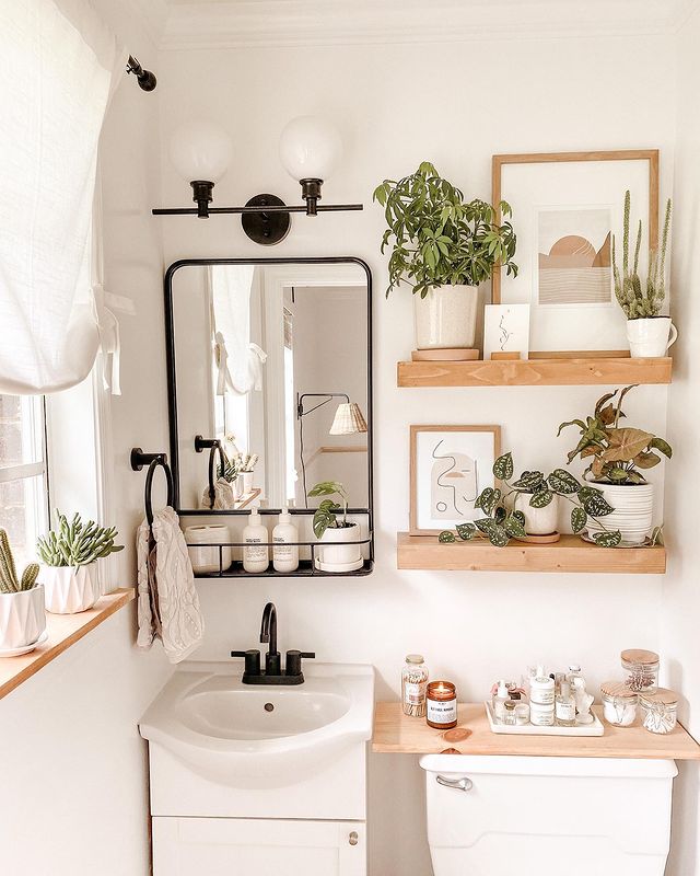 tiny small bathroom with over the toilet wood floating shelves