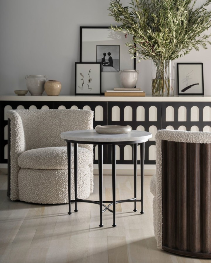  Volute Swivel Chair is a modern reimagining of traditional opera house gallery seating. The back of the chair is finely crafted in oak to mimic the unpredictable and undulating edges of seaside cliffs. Also featuring the Magnus Credenza and Classico End Table