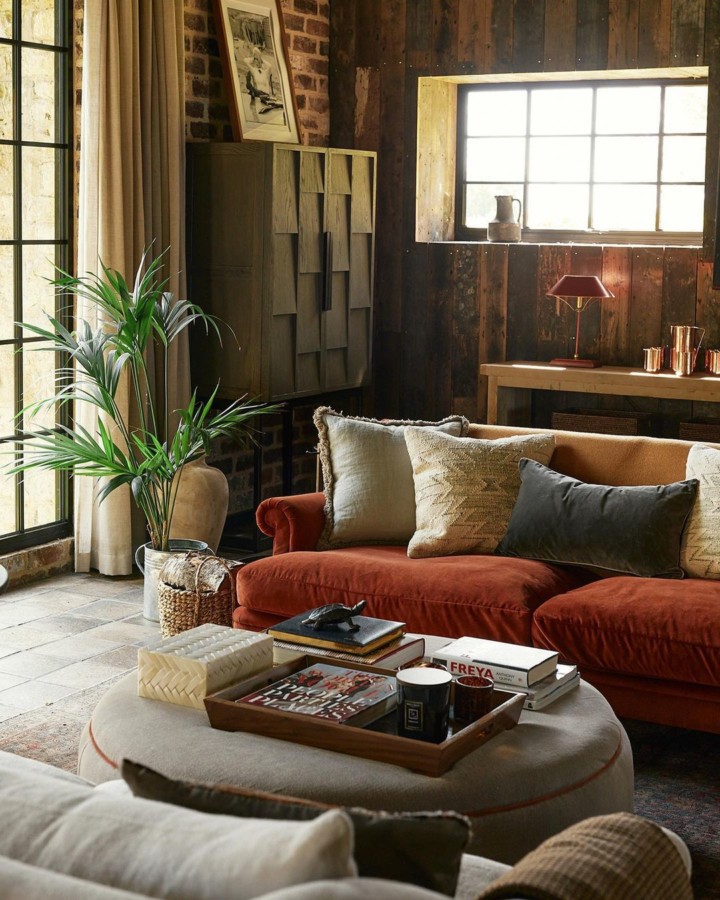 old meets new countrey living room with orange velvet sofa