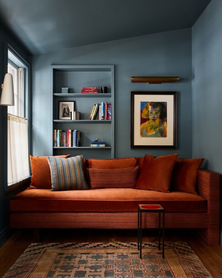 blue room with dark orange velvet sofa by GACHOT