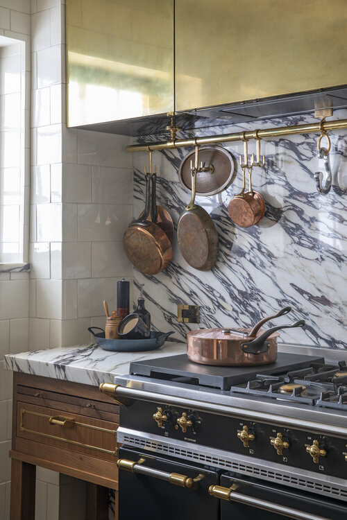 timeless kitchen with Extra-thick Calacatta Viola marble countertop and gold cabinets
