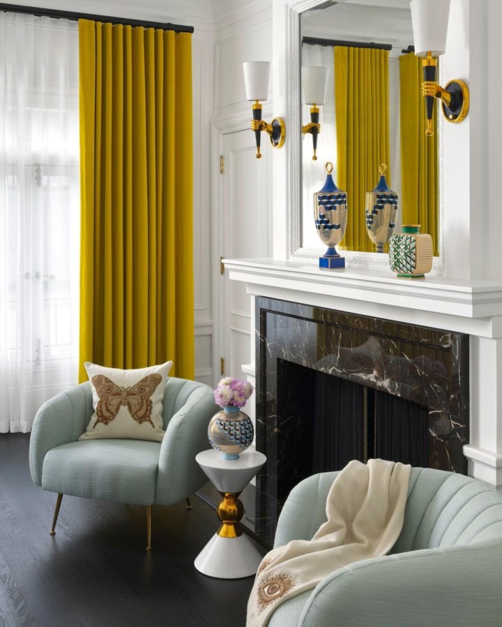 living room with mellow yellow curtains and light blue armchairs