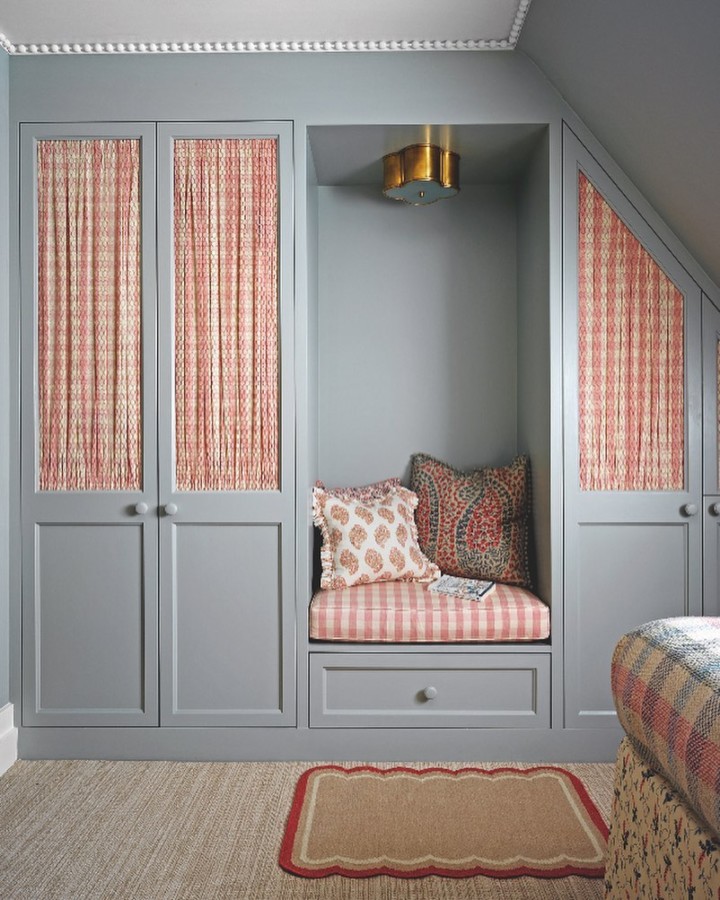 red and white Plaid curtains lend character to the cupboard doors