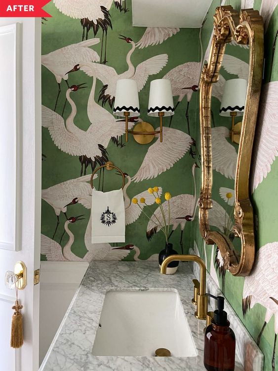 bathroom with tropical green bird-patterned wallpaper