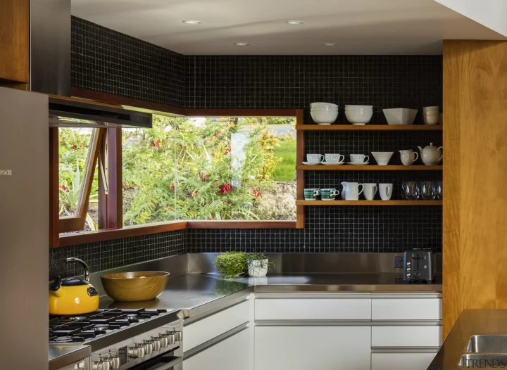 kitchen with modern frameless corner window