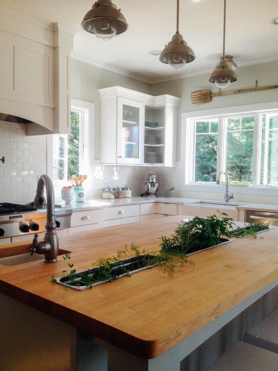 custom kitchen with herb garden built-ins in the island