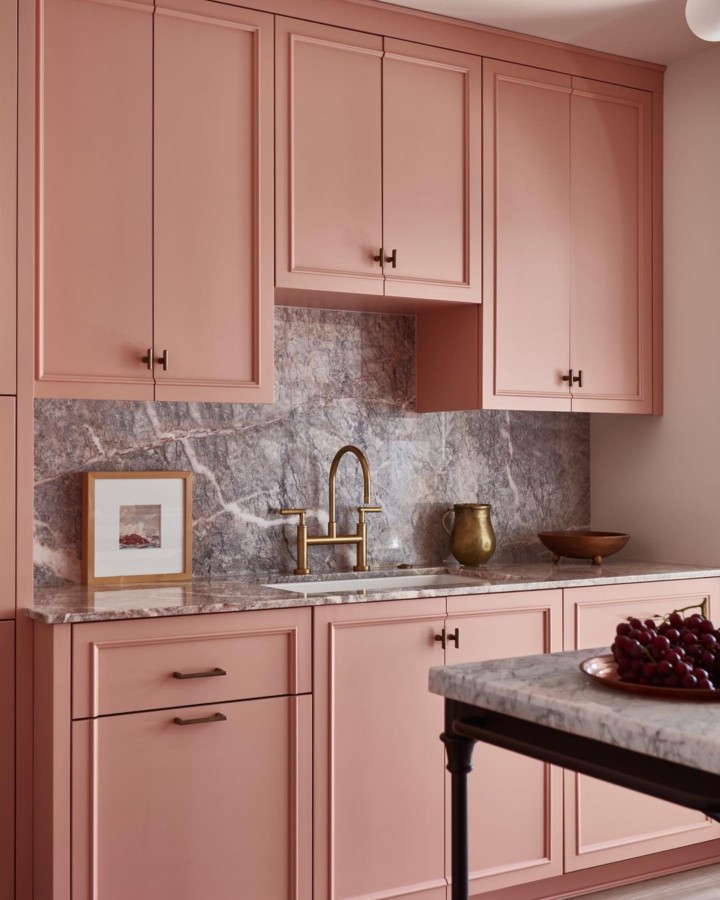 Soothing pink kitchen with marble counters