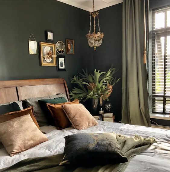 modern mid century bedroom with dark green accent wall