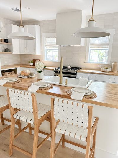 white kitchen island with wood counter