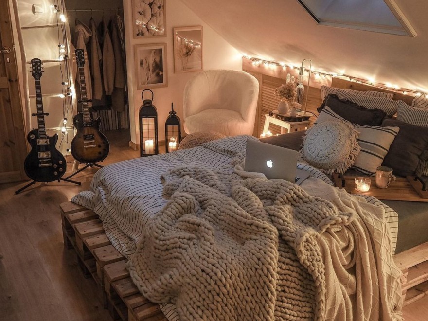 modern boho bedroom with pallet bed and fairy lights