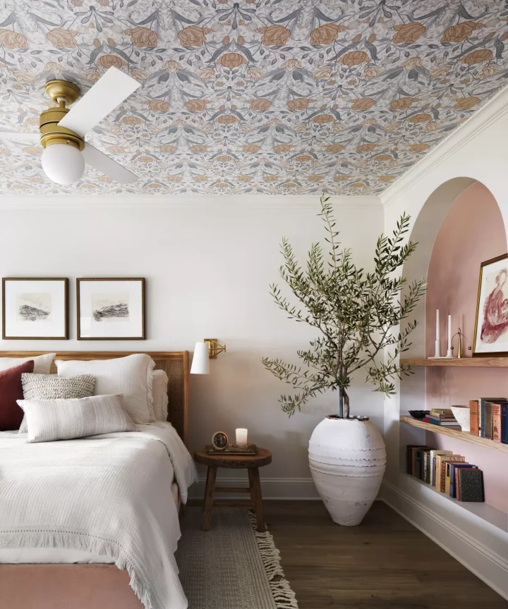 bedroom with floral wallpaper across the ceiling