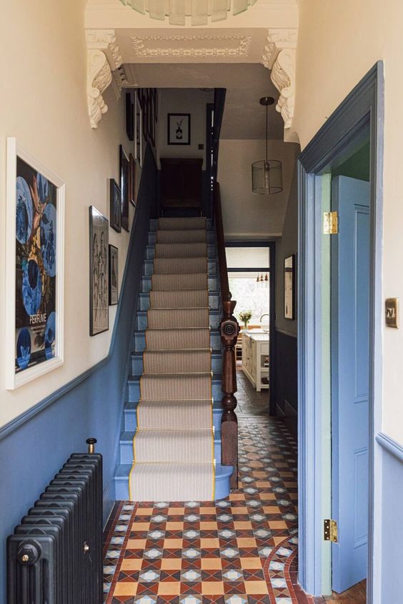 naroow blue hallway with stairs