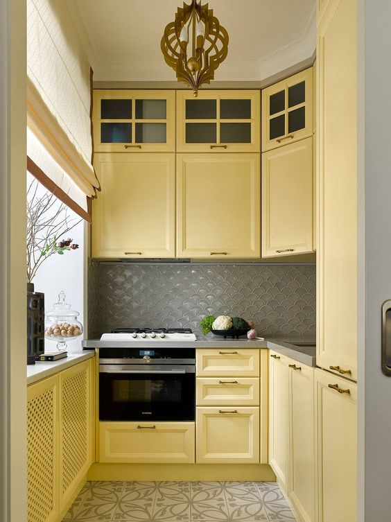 grey kitchen countertops with yellow cabinets
