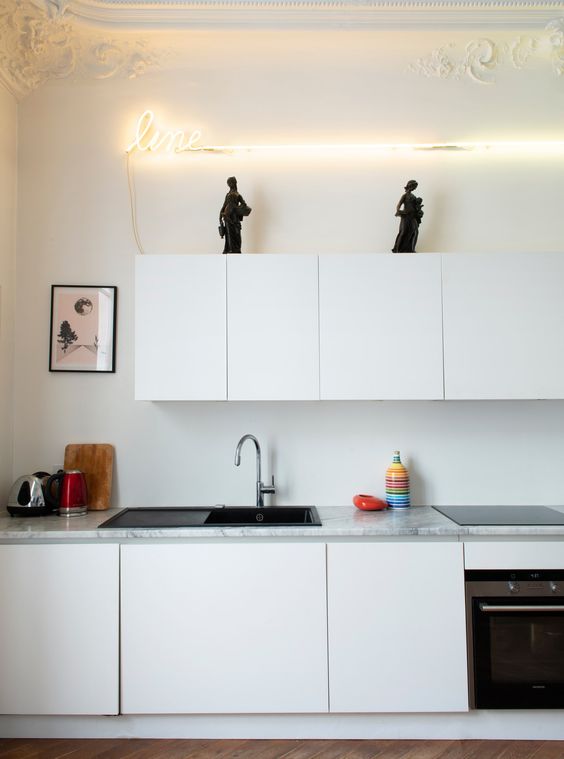 neon sign above kitchen cabinets