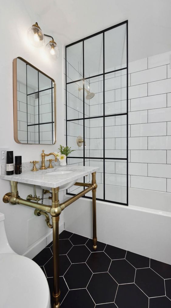 black-and-white-bathroom-with-brass-faucet