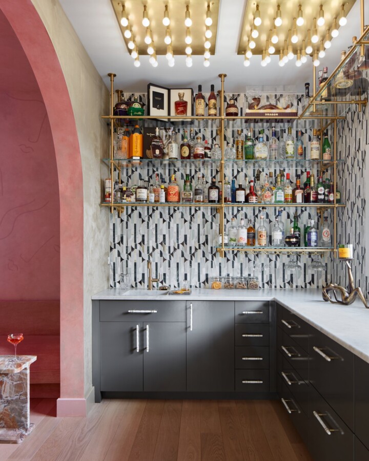 home bar with Ceiling mounted brass shelving