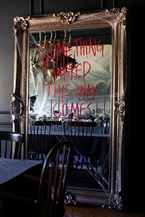 Halloween mirror decoration with message with red lipstick