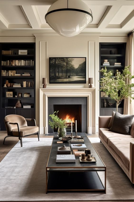 crea beige black living room with plants and TV above the fireplace