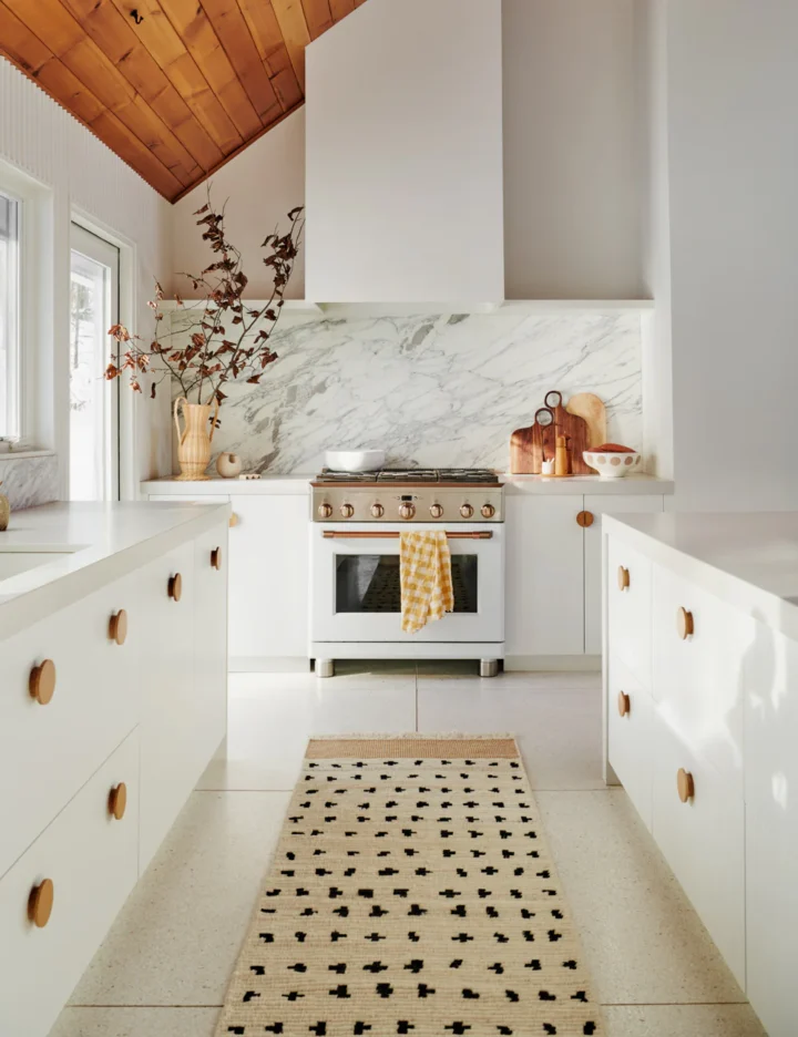 white kitche with black and white rug
