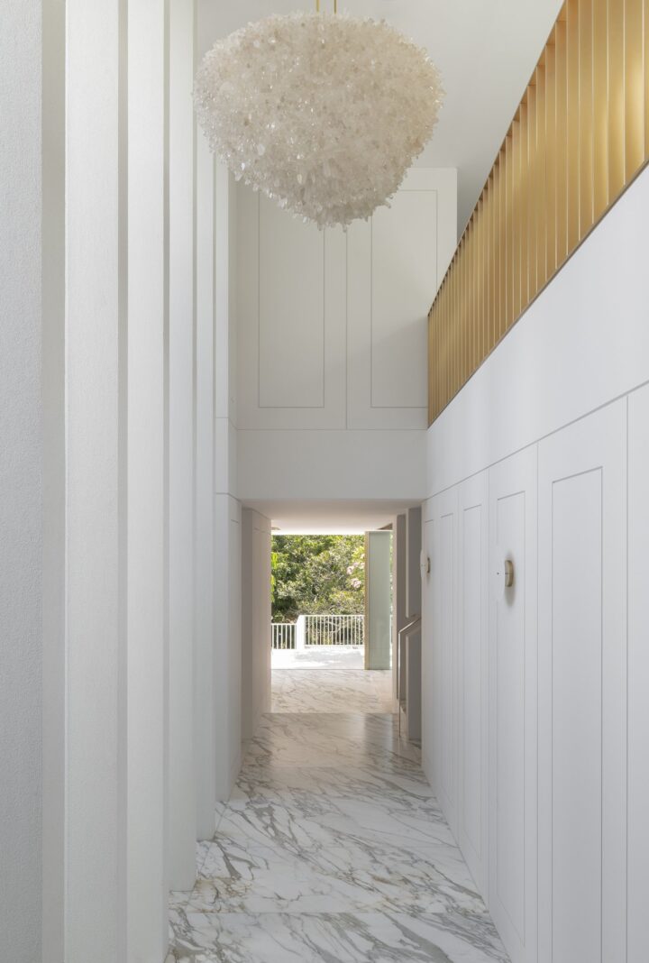 contemporary white hallaway with barble flooring by Hancock Architects