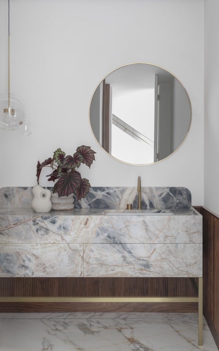 contemporary bathroom with marble vanity by Hancock Architects