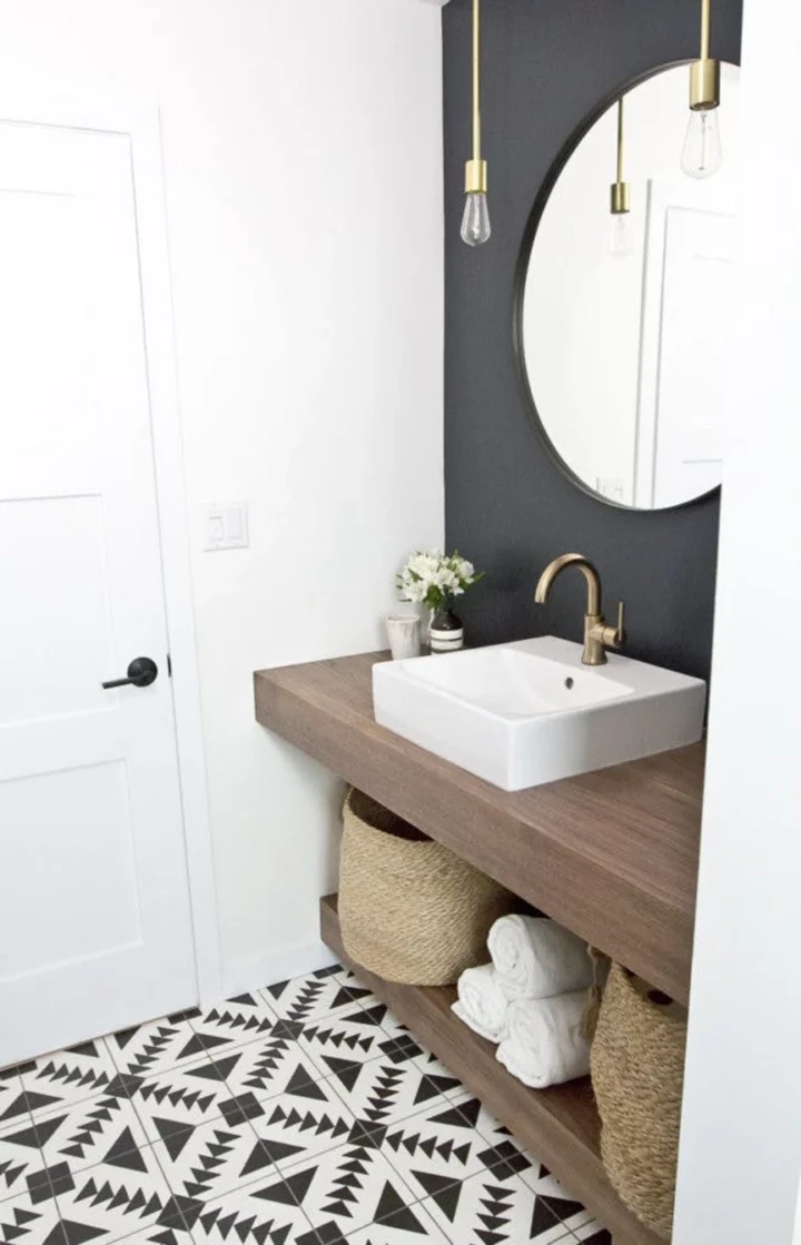 black and white bathroom with square vanity and brass hardware