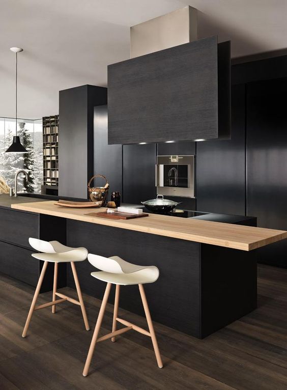 modern minimalist dark black kitchen cabines with island with wood worktop
