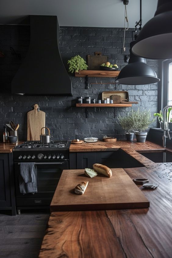 dark black farmhouse kitchen cabinets with black industrial lighiting wan wood worktop