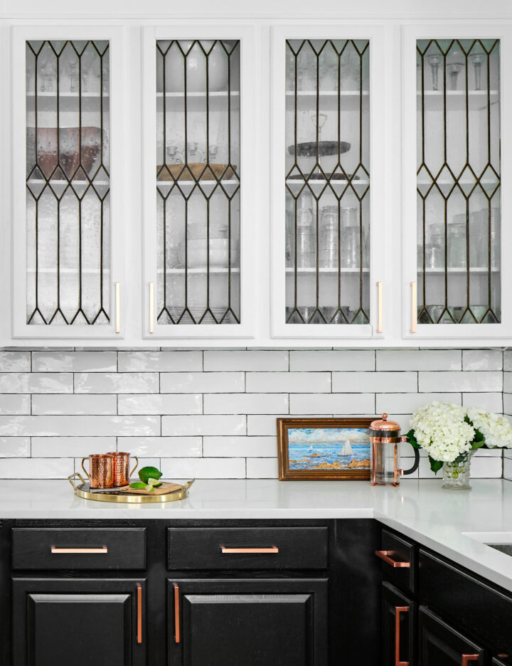 black and white kitchen with traditional Leaded glass cabinet doors
