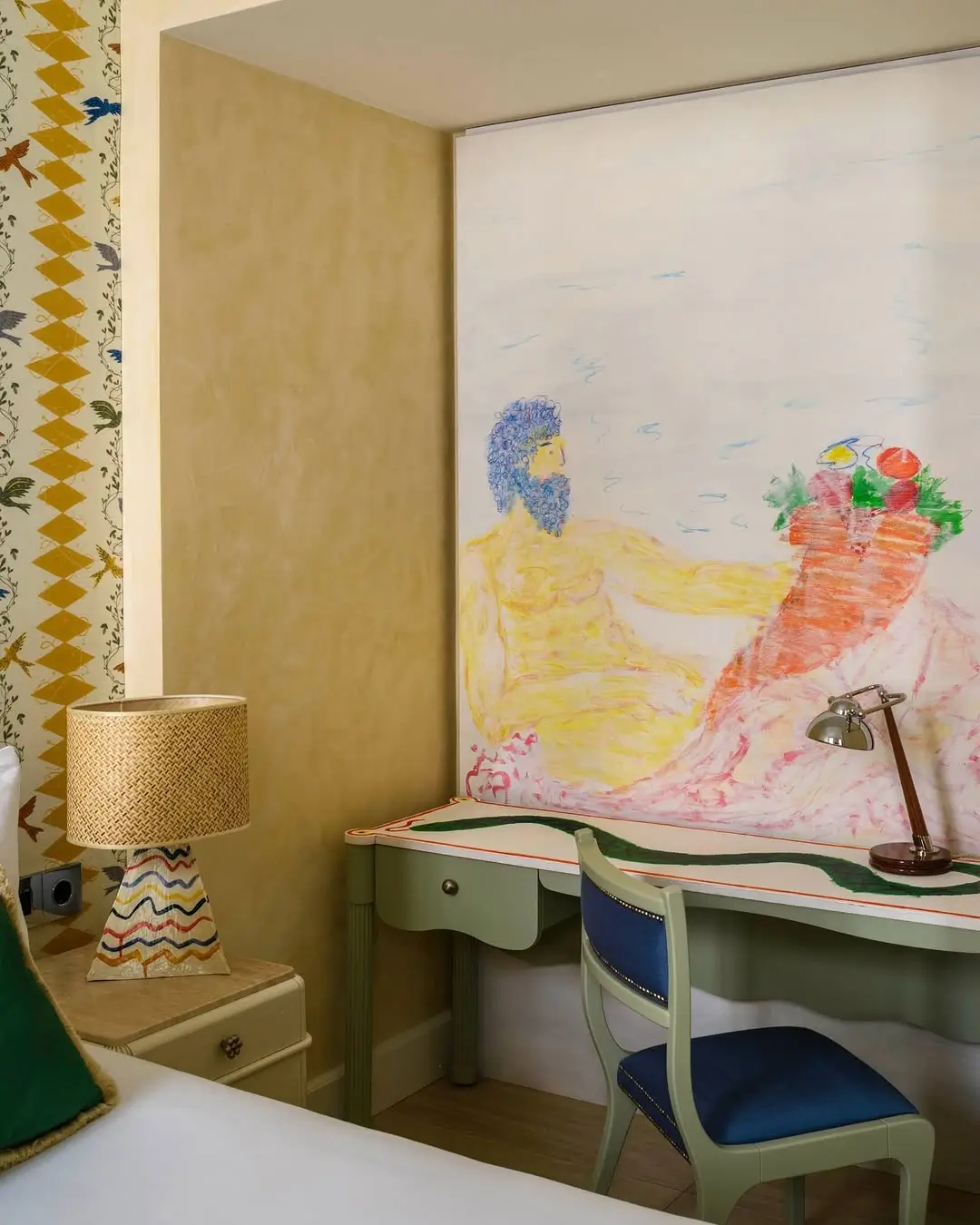 Artist-designed workspace inside Casa Monti Rome featuring a pastel mural inspired by classical mythology, custom green writing desk, and eclectic interiors in Michael McGregor’s signature expressive style.